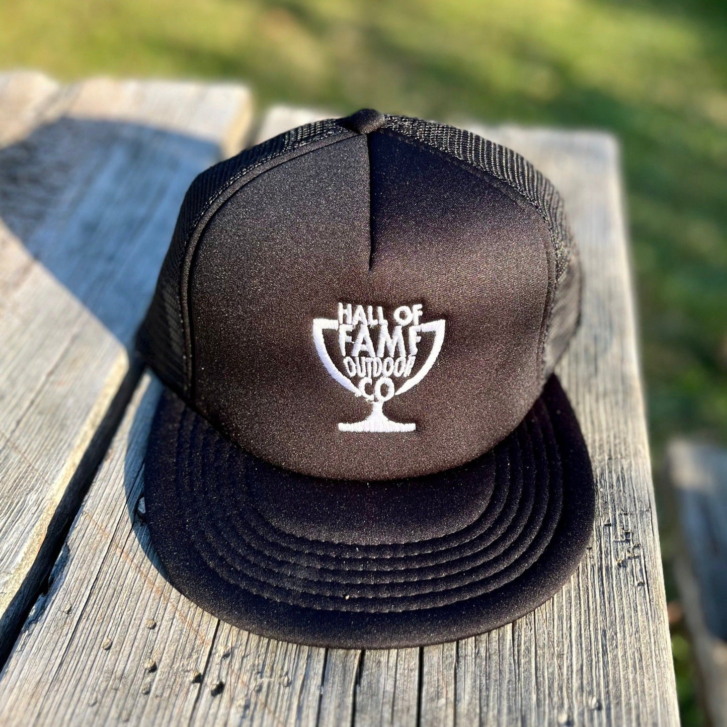 retro HOFO trucker hat. black. front.