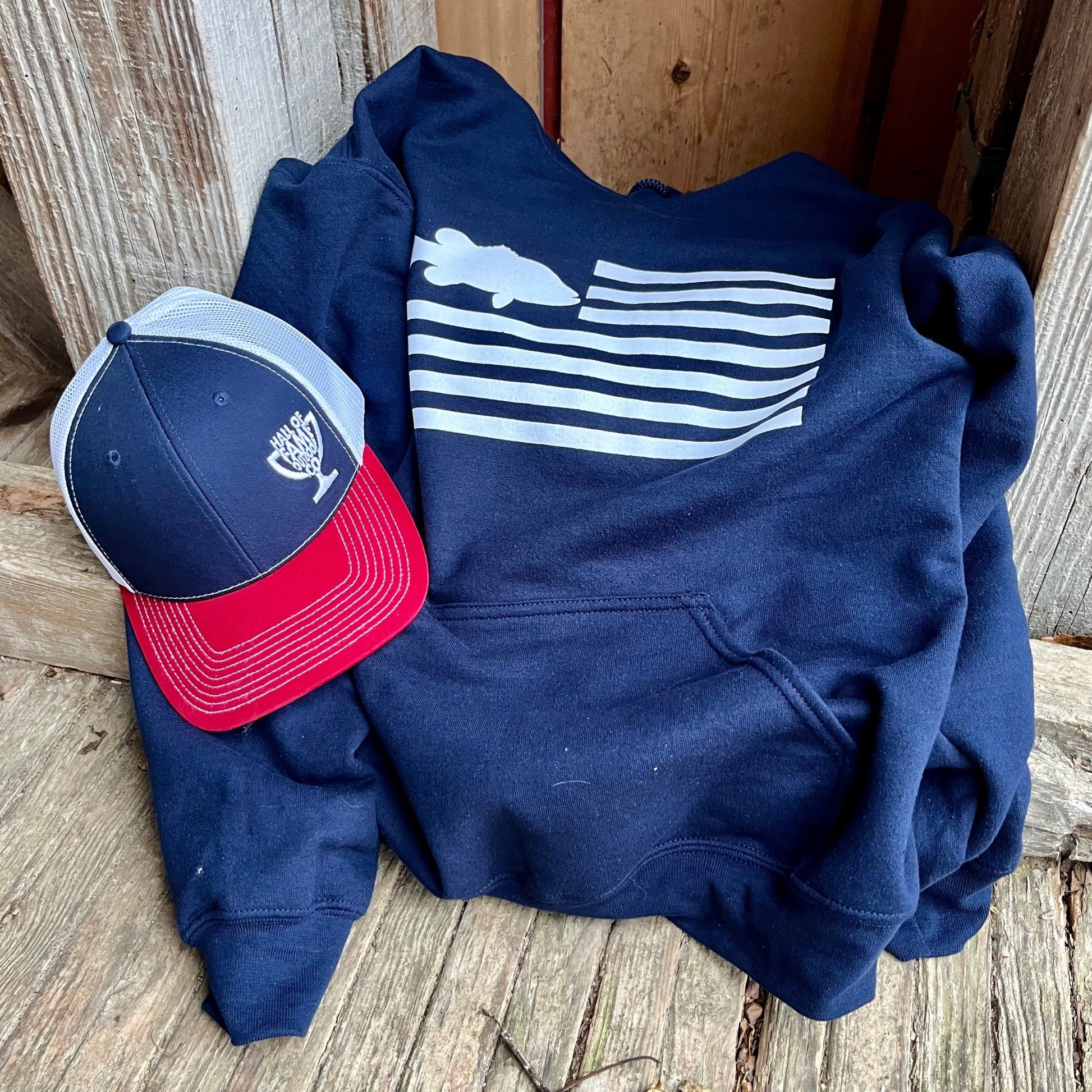 Freedom fish hoodie. blue. front. with hat.